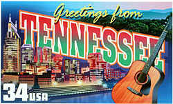 Tennessee Greeting: Tennessee's distinction as the home of country music is represented by an acoustic guitar in the foreground. Behind it is the night skyline of Nashville, the capital, and the Cumberland River that loops through the city, and in the distance are the Great Smoky Mountains.